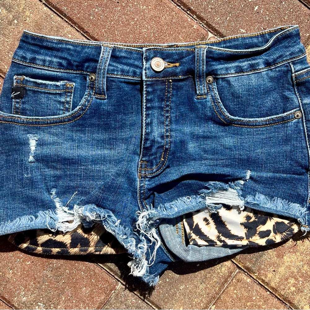 KanCan Blue Jean Shorts with Distressed Hem and Animal Print